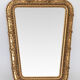 Wooden mirror and gilded stucco decorated with rockery style rinceaux and shells