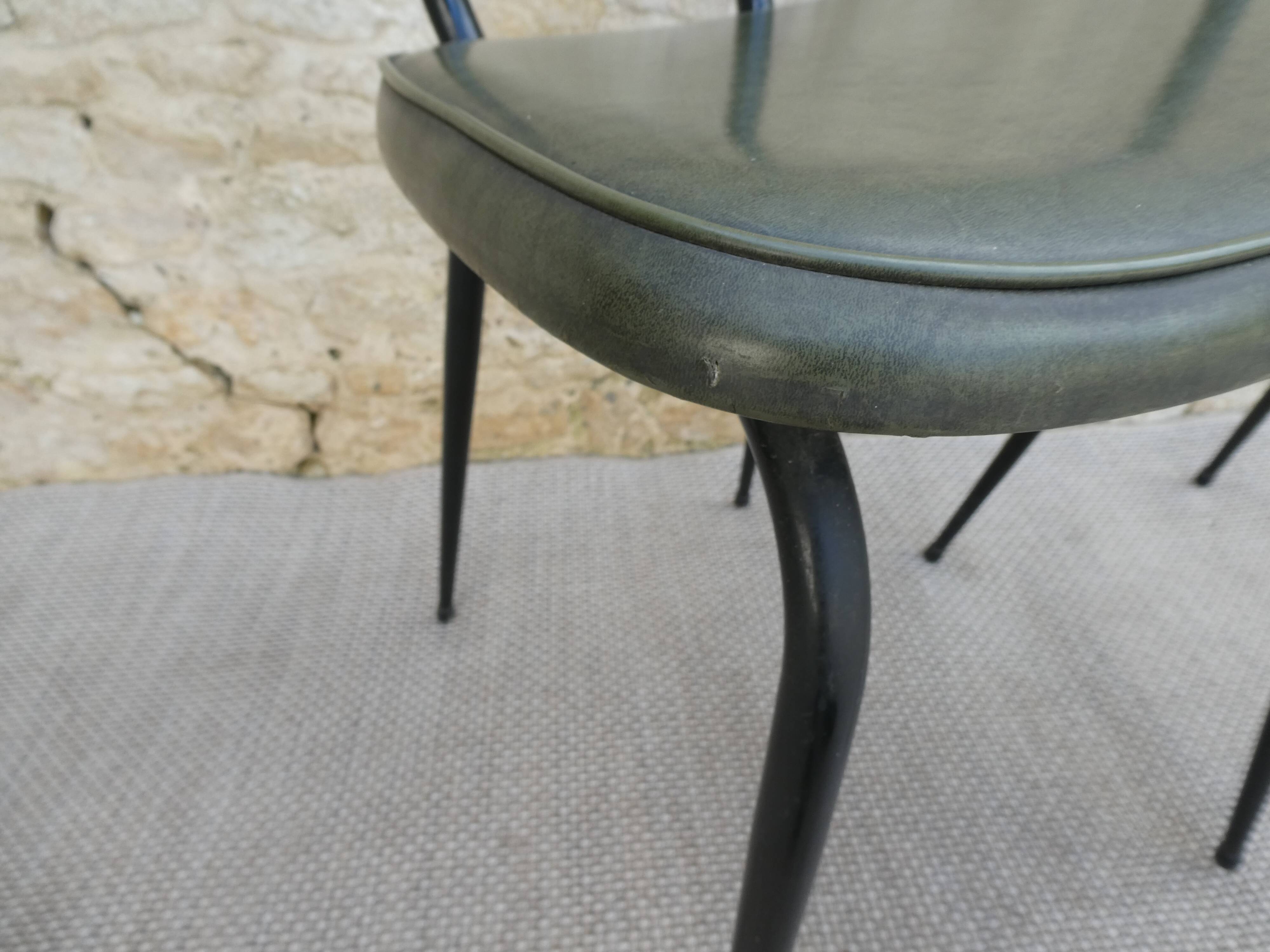 Pair of black metal chairs and khaki green skai, 60s
