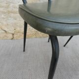 Pair of black metal chairs and khaki green skai, 60s