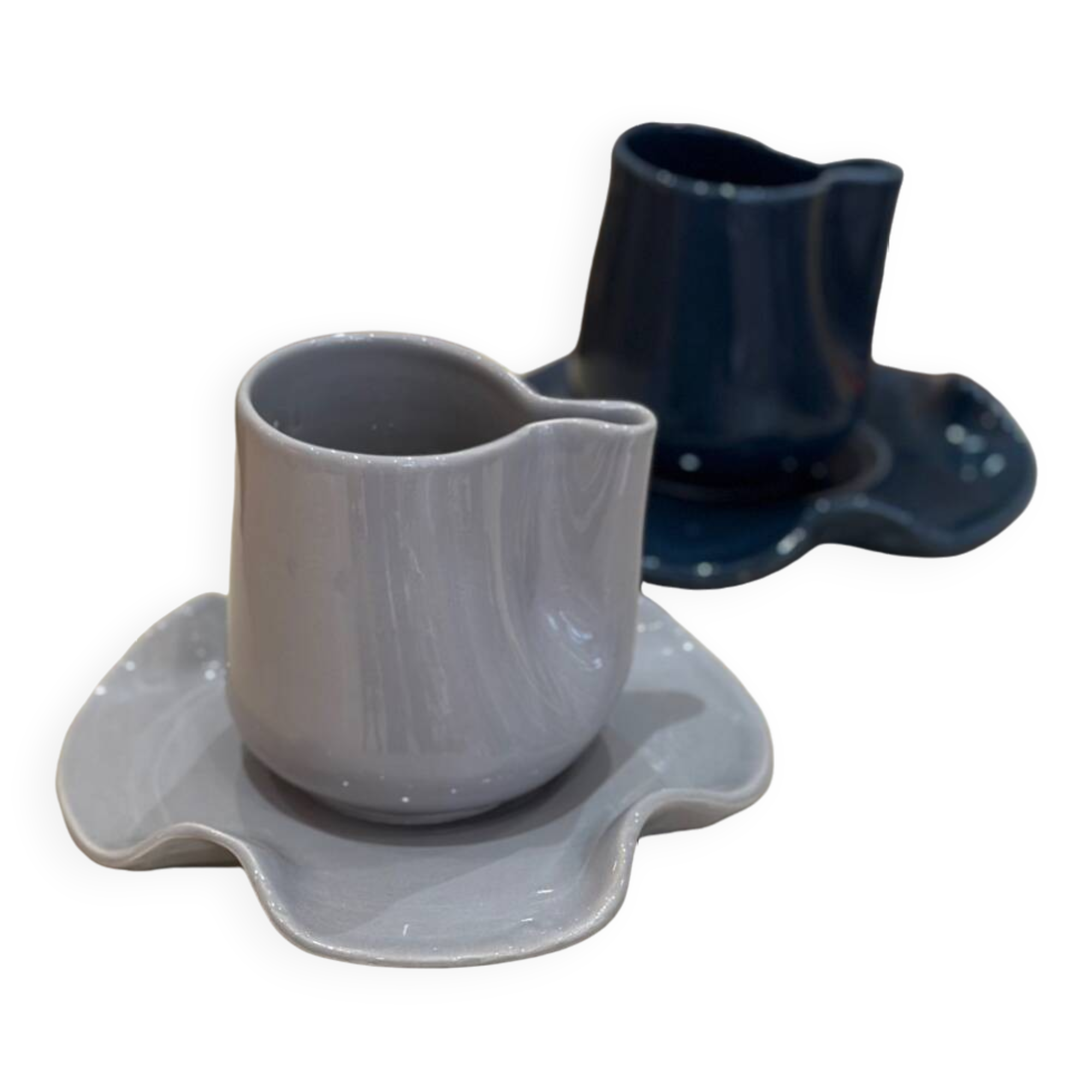 Set of ceramic artisan mugs with blue-grey pop water lily design.