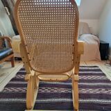 Rocking chair in arched wood and cane