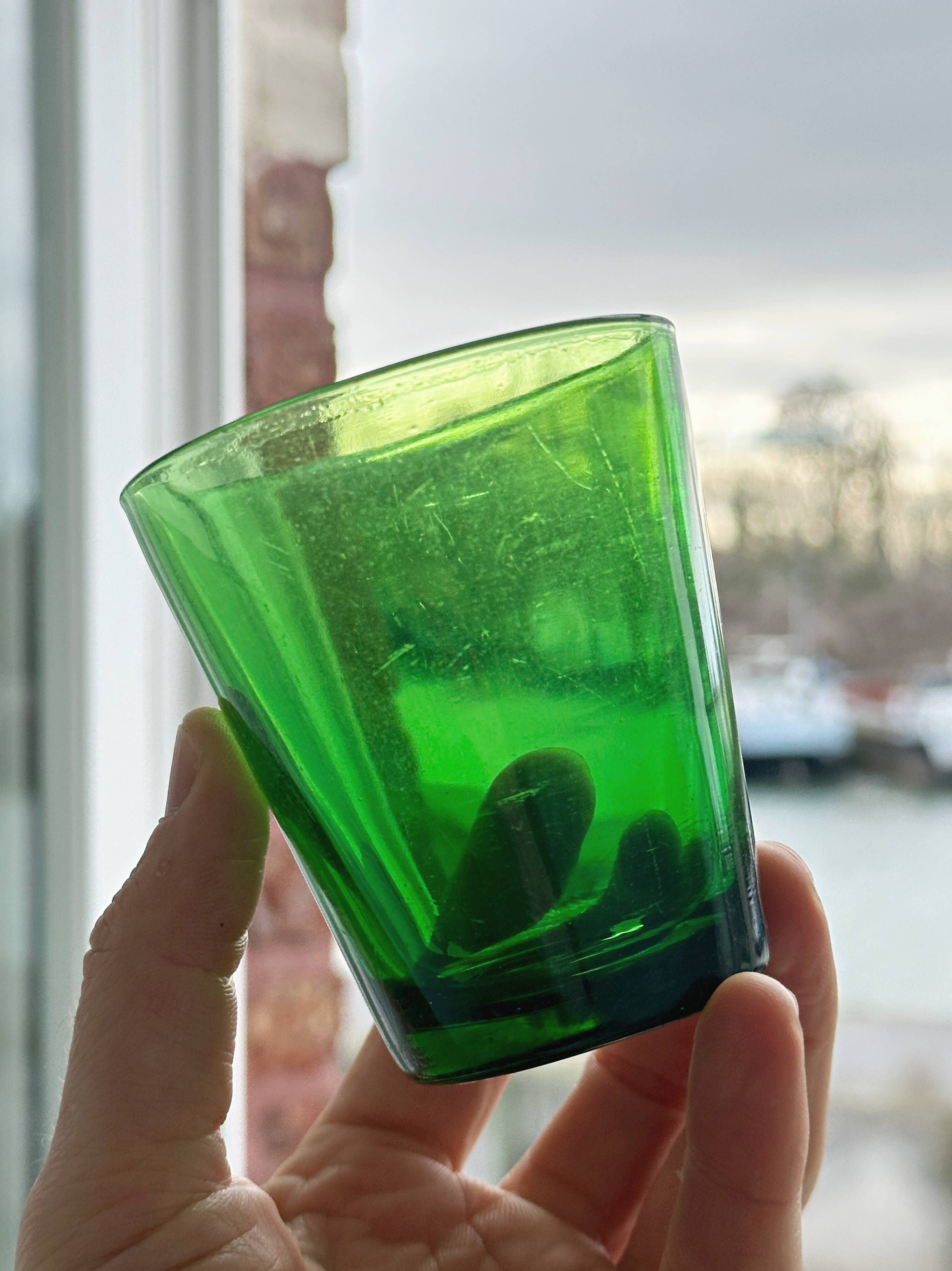 5 translucent green glasses