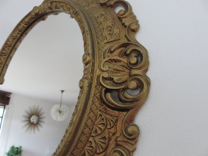 Golden baroque oval mirror, 60s-70s