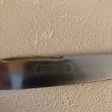 Complete set of 12 stainless steel table knives with Bakelite handles and Art Deco ferrules
