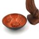 Mexican ceramic catchall in orange and black, 1970s sun face.