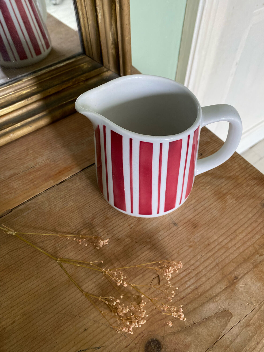 Old striped milk jug