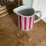Old striped milk jug