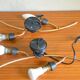 Pair of stylized 2-branch brass wall lights