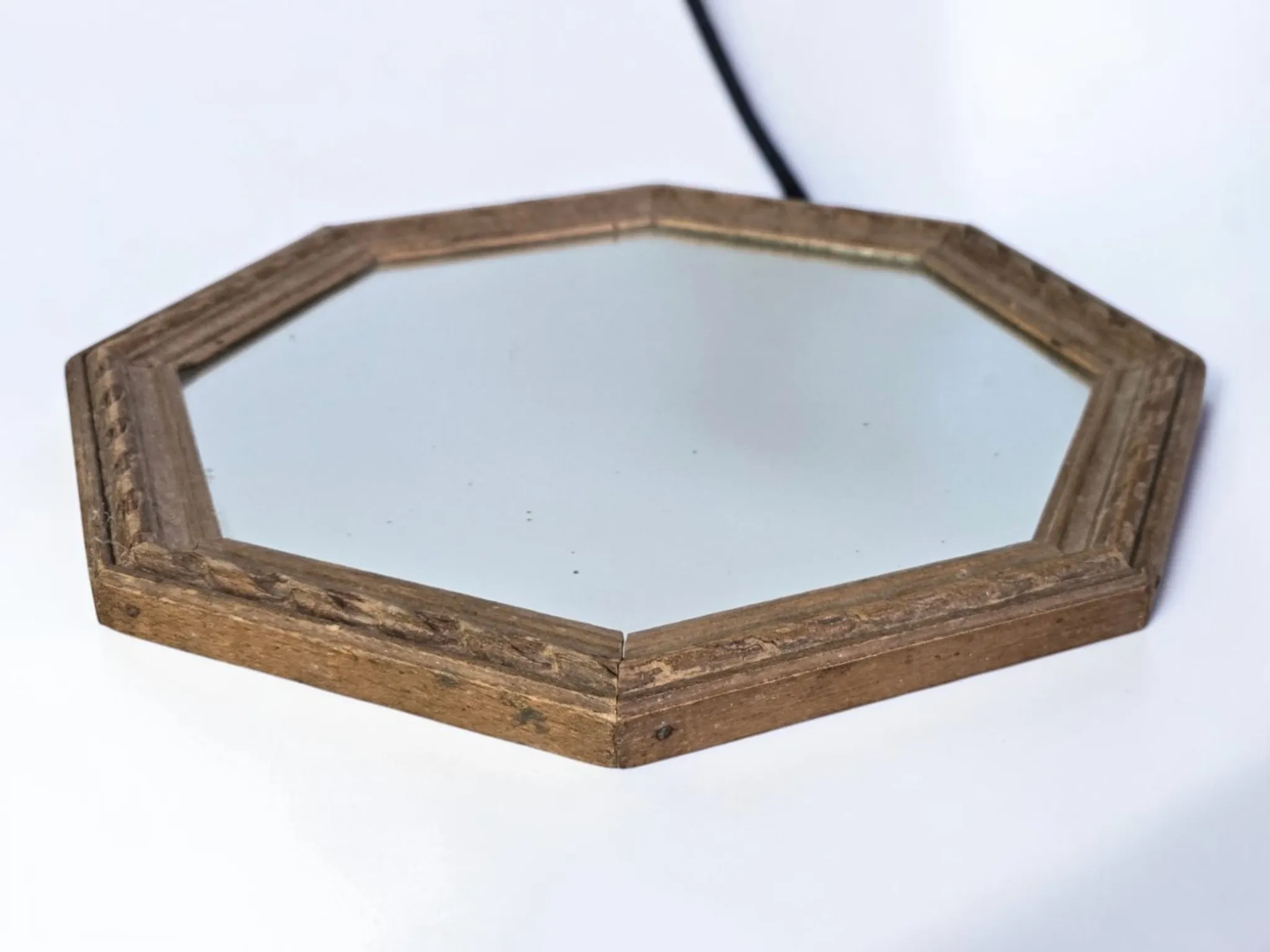 Octagonal mirror in carved wood