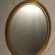 Miroir ovale biseauté en bois doré 78x58cm