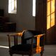 Early 20th century Danish Art Nouveau armchair, reupholstered in charcoal boucle.
