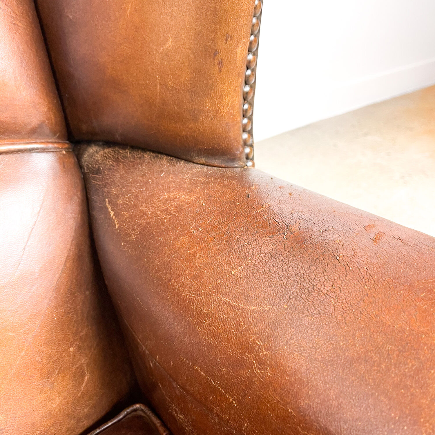 Dark brown sheep leather wingback armchair vintage