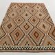 Grand kilim vintage motifs géométriques, tons terre et bleu pastel