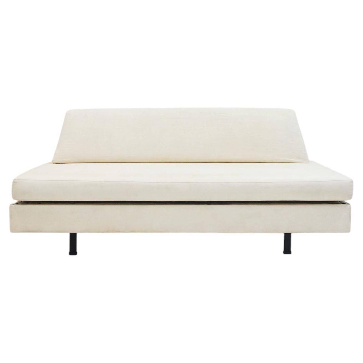 Italian modernist daybed with white upholstery and iron frame.