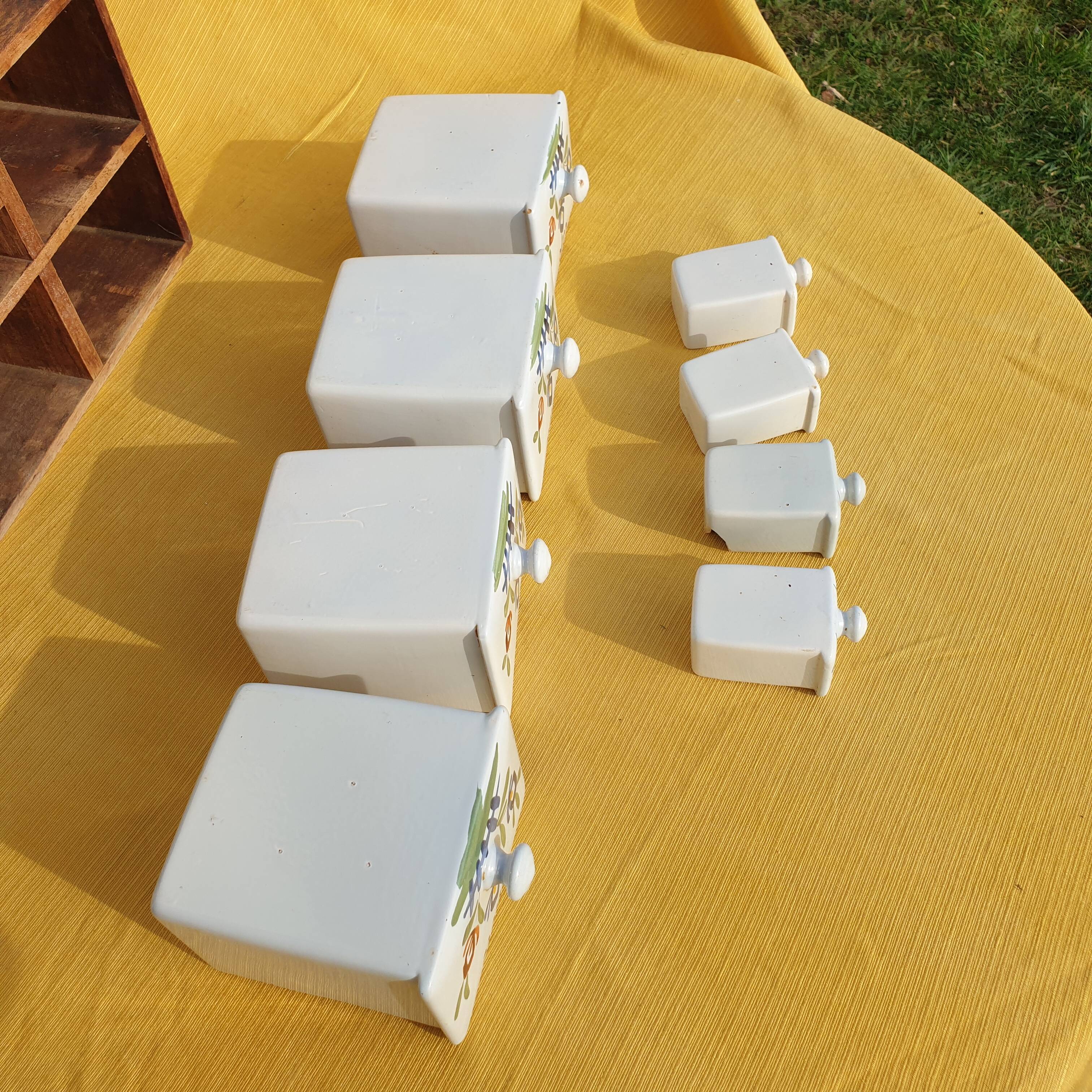 Vintage wooden spice rack with ceramic drawers