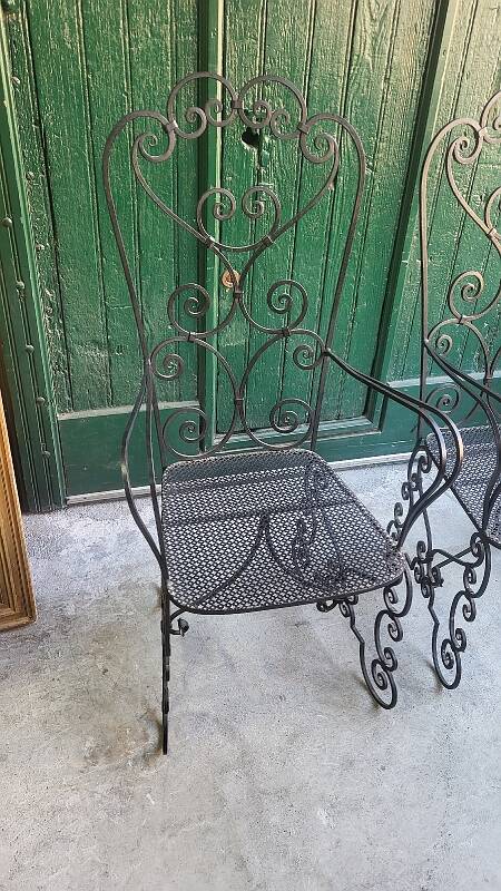 Pair of black wrought iron armchairs