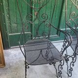 Pair of black wrought iron armchairs