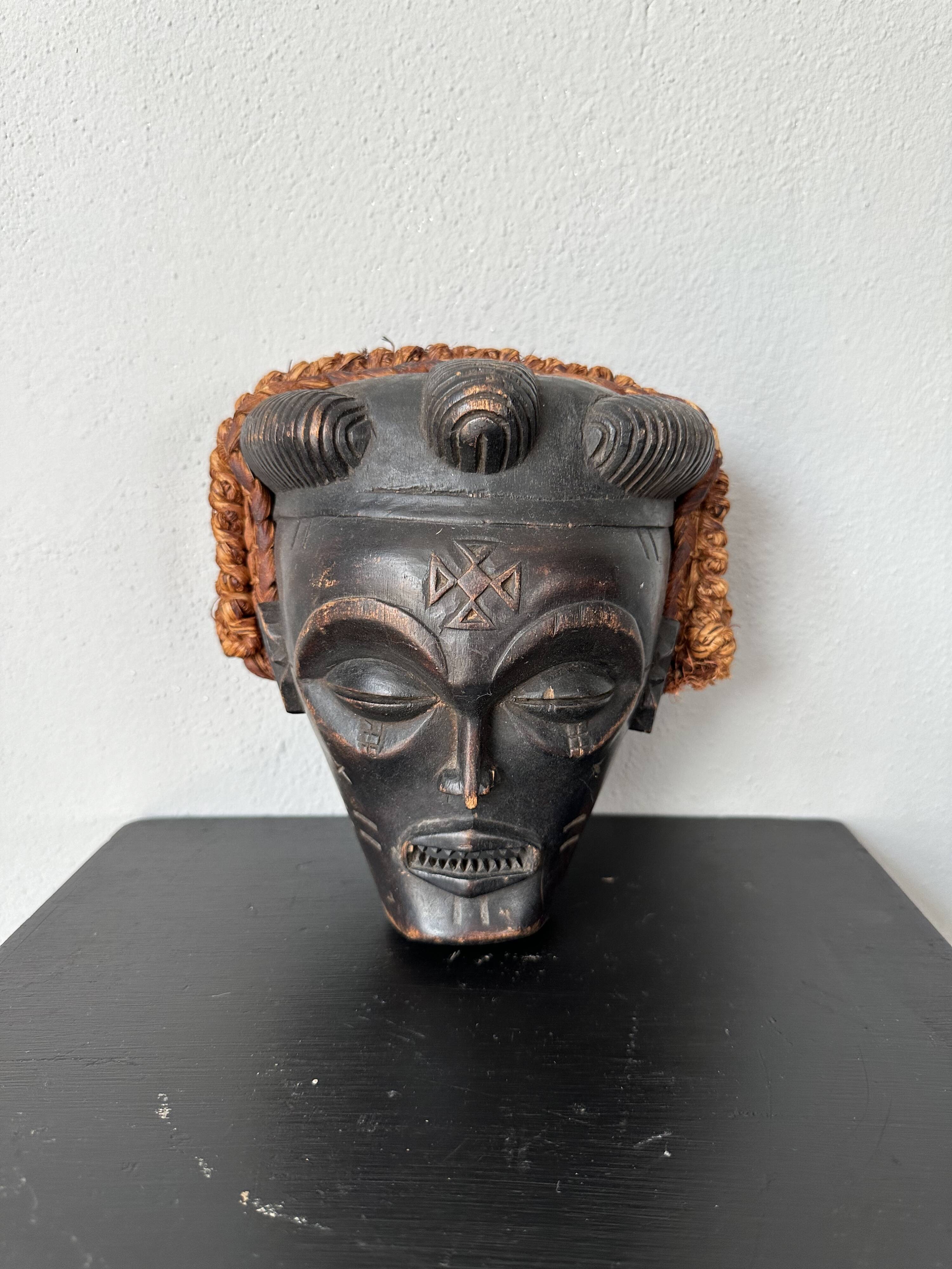 Black and orange tribal mask