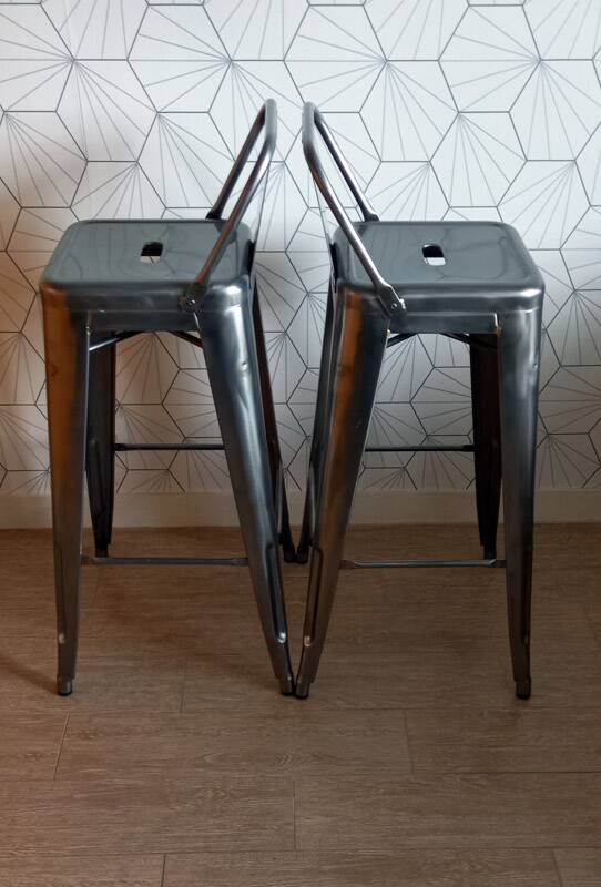 Pair of tolix hpd 75 stools – in varnished raw steel.