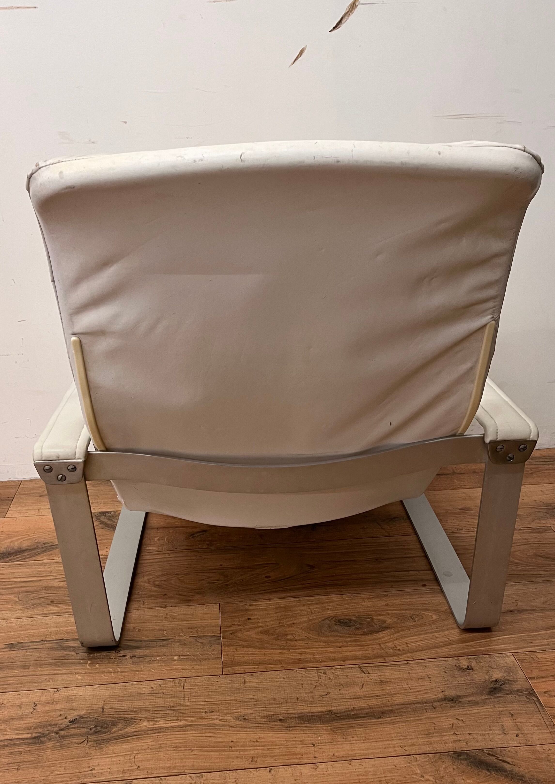 Pulkka armchair by Ilmaria Lappalainen and its ottoman
