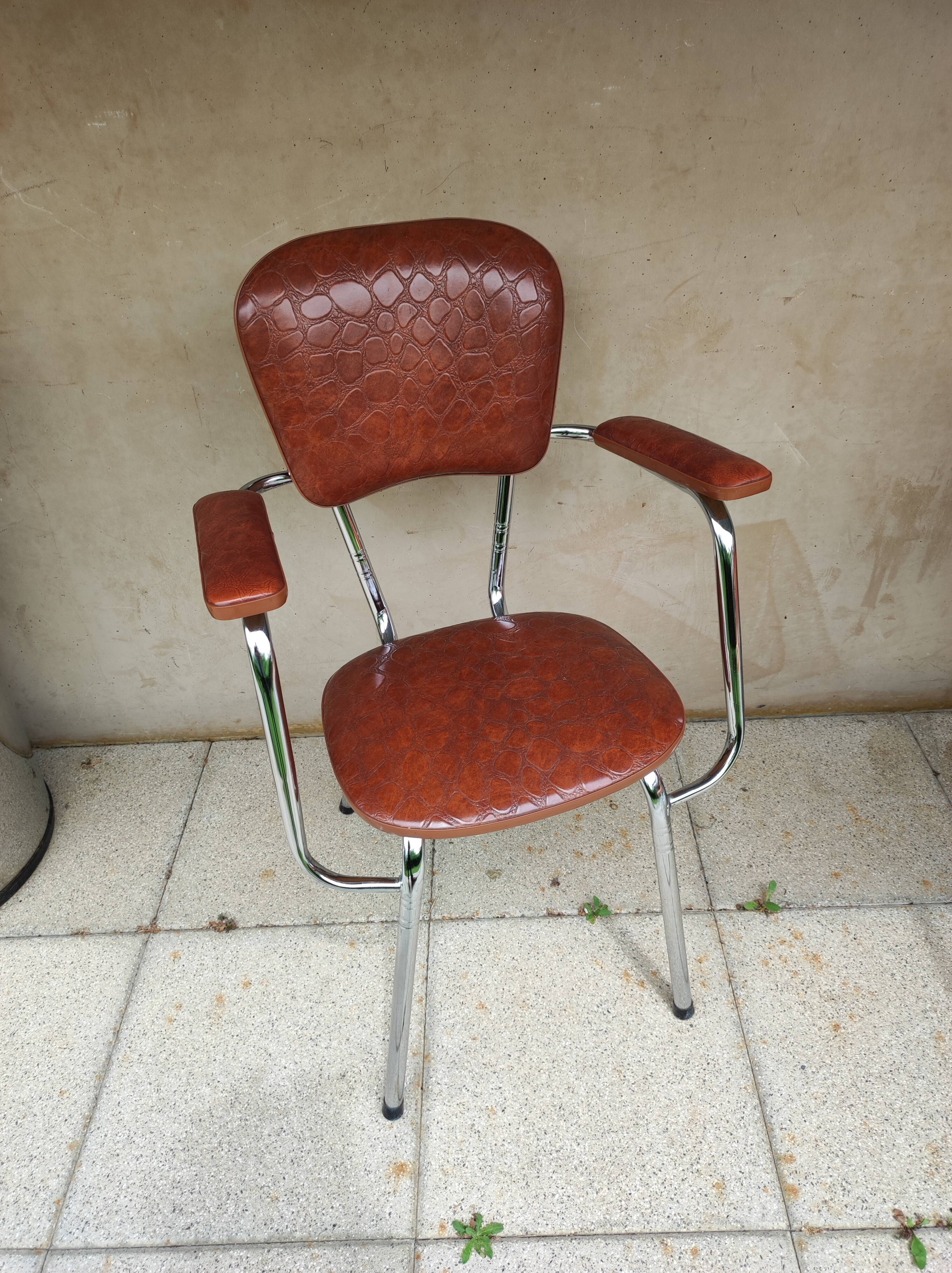 Stainless steel skaï armrest chair from 1958