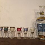 Liquor carafe and 6 assorted glasses