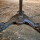 Old French bistro table with a marble top and a cast iron base.