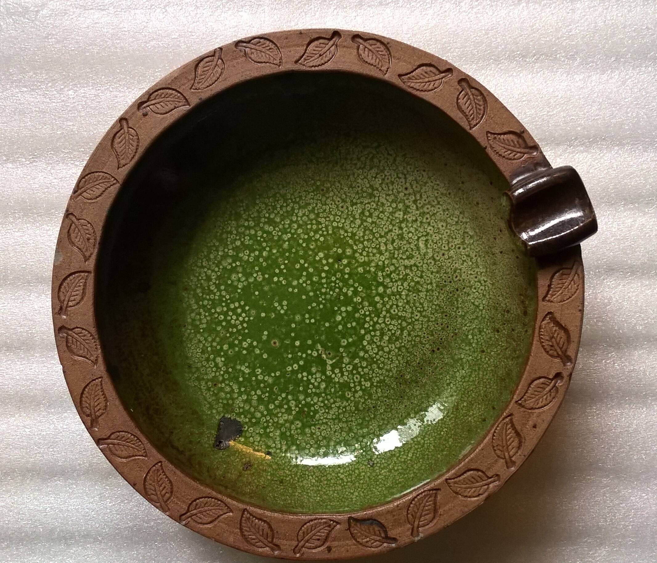 Vintage green enameled ceramic ashtray signed.