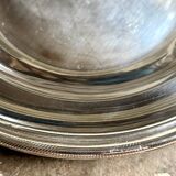 Round, hollow silver-plated metal dish