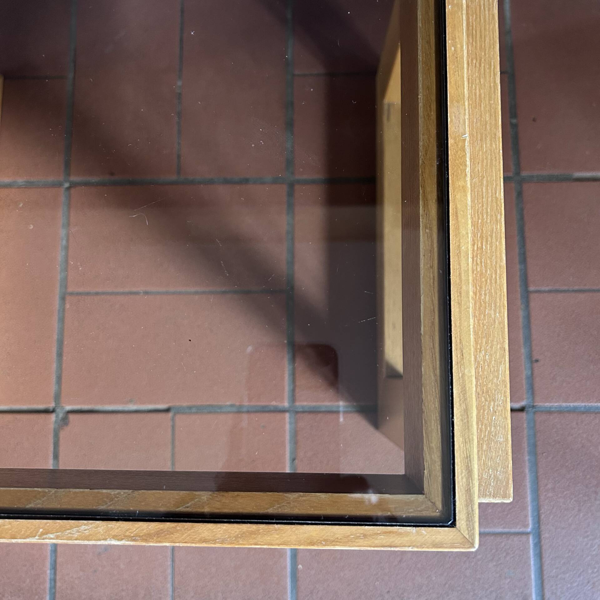 Modernist side table in wood and smoked glass