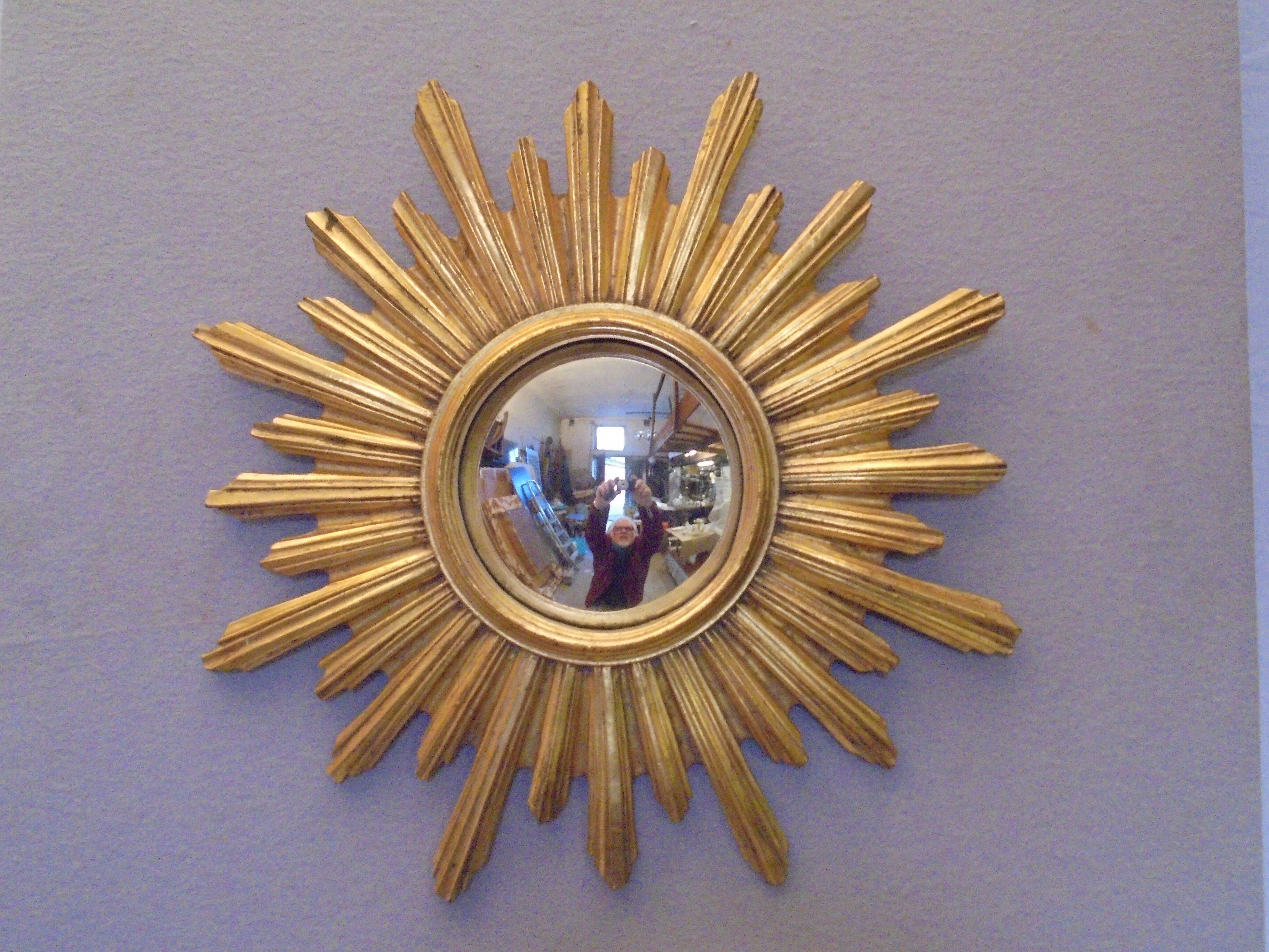 Sun mirror in golden resin from the 70s
