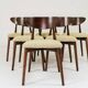 Green and walnut fabric dining chairs