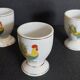 Porcelain egg cups with rooster decoration, set of three