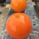 Two orange opaline globes, 30 cm diameter