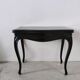 Molded blackened wooden play table, arched legs, green felt