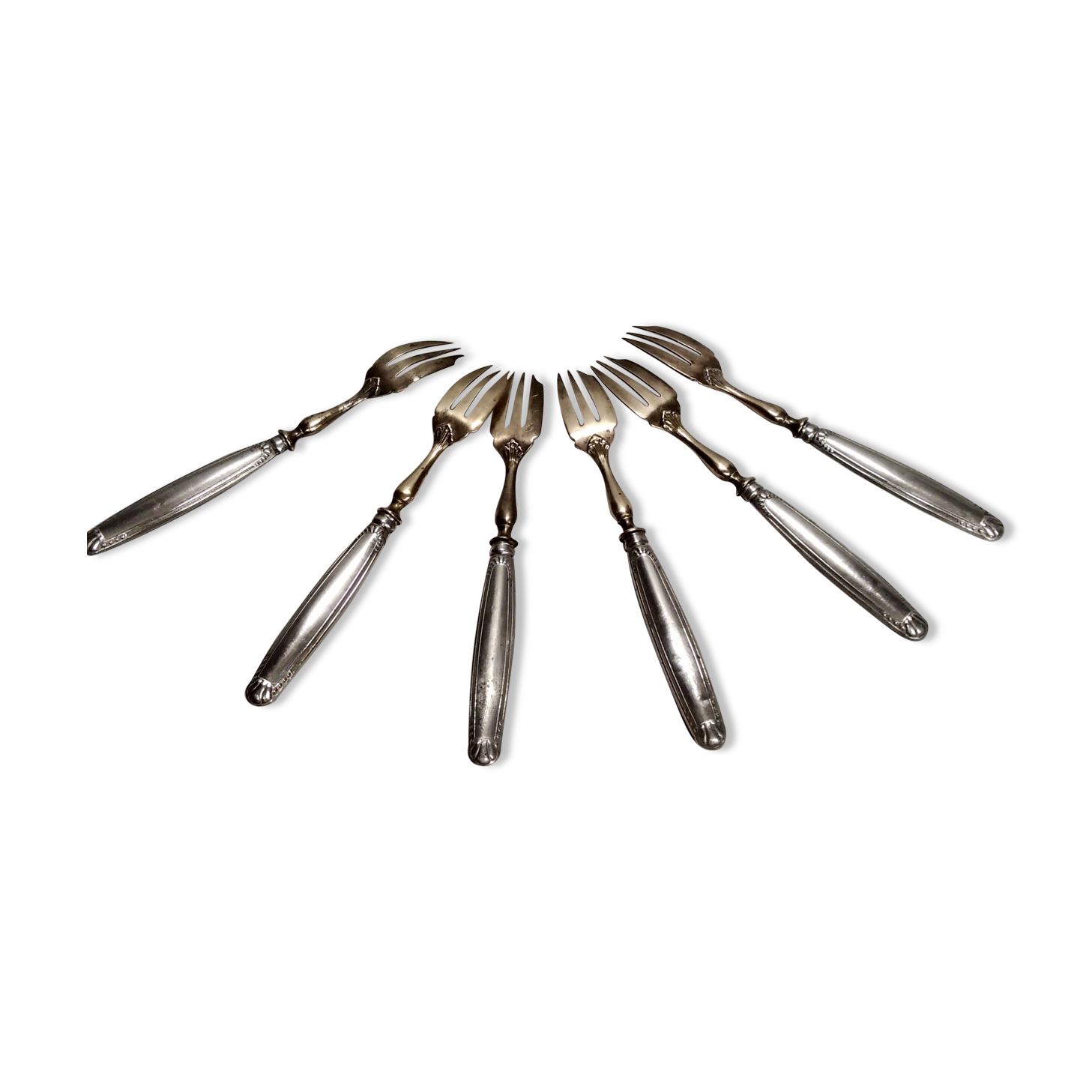 Silver and gold cake fork service