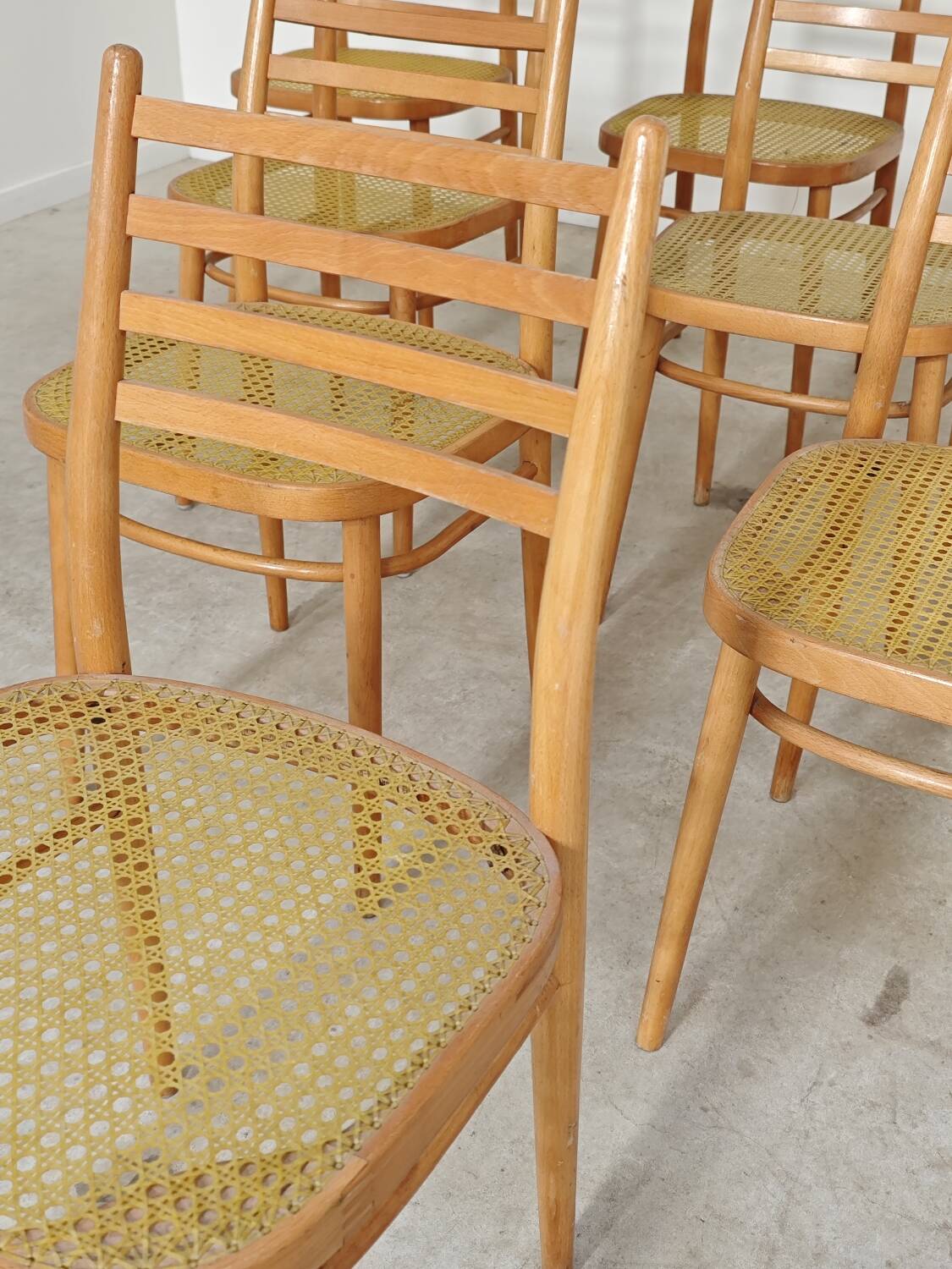 Set of 10 Bystrice tone wooden and caned chairs from the 1960s.