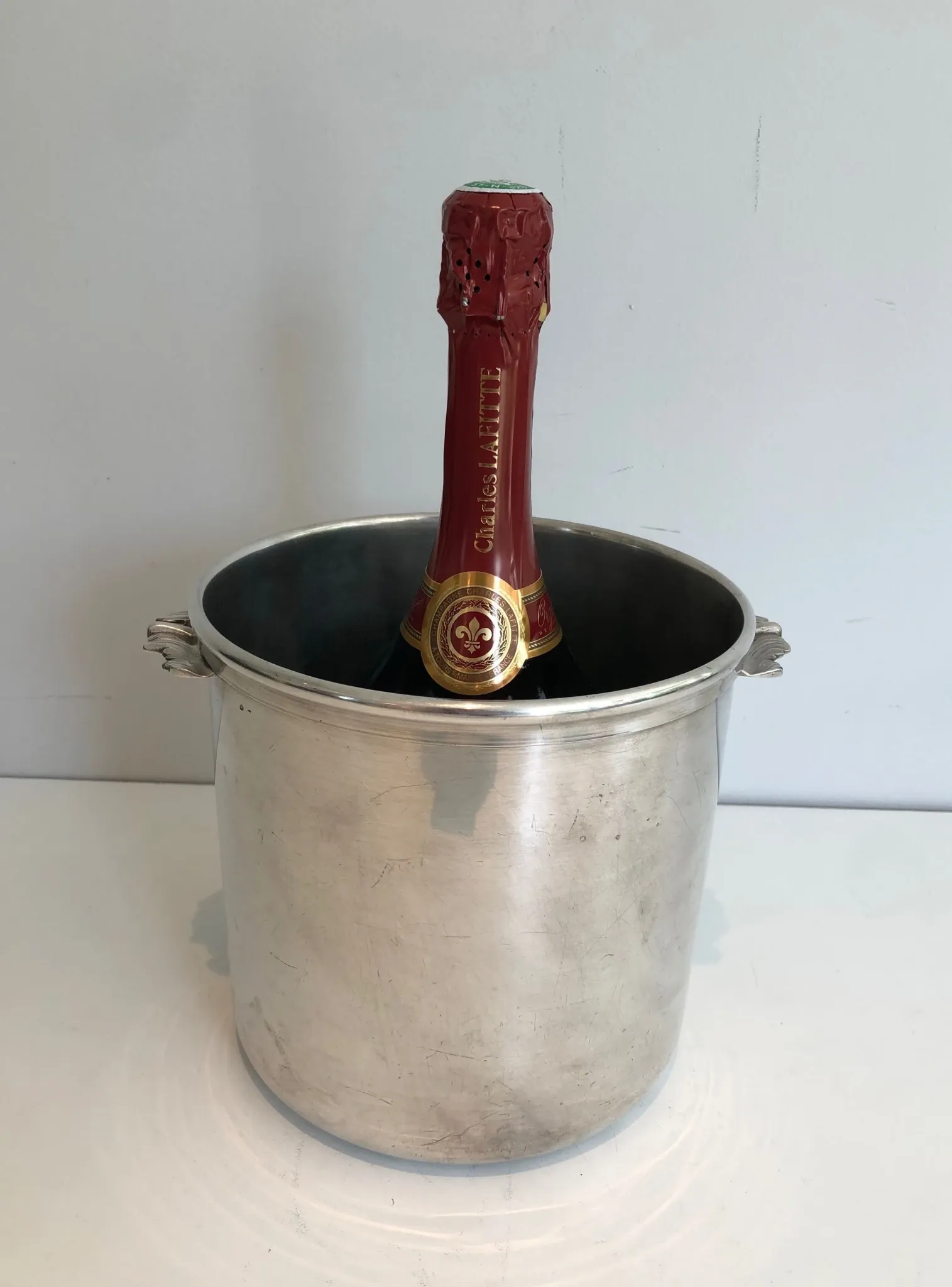Cylindrical Silver-Plated Champagne Bucket with Small Leaf-Shaped Handles.