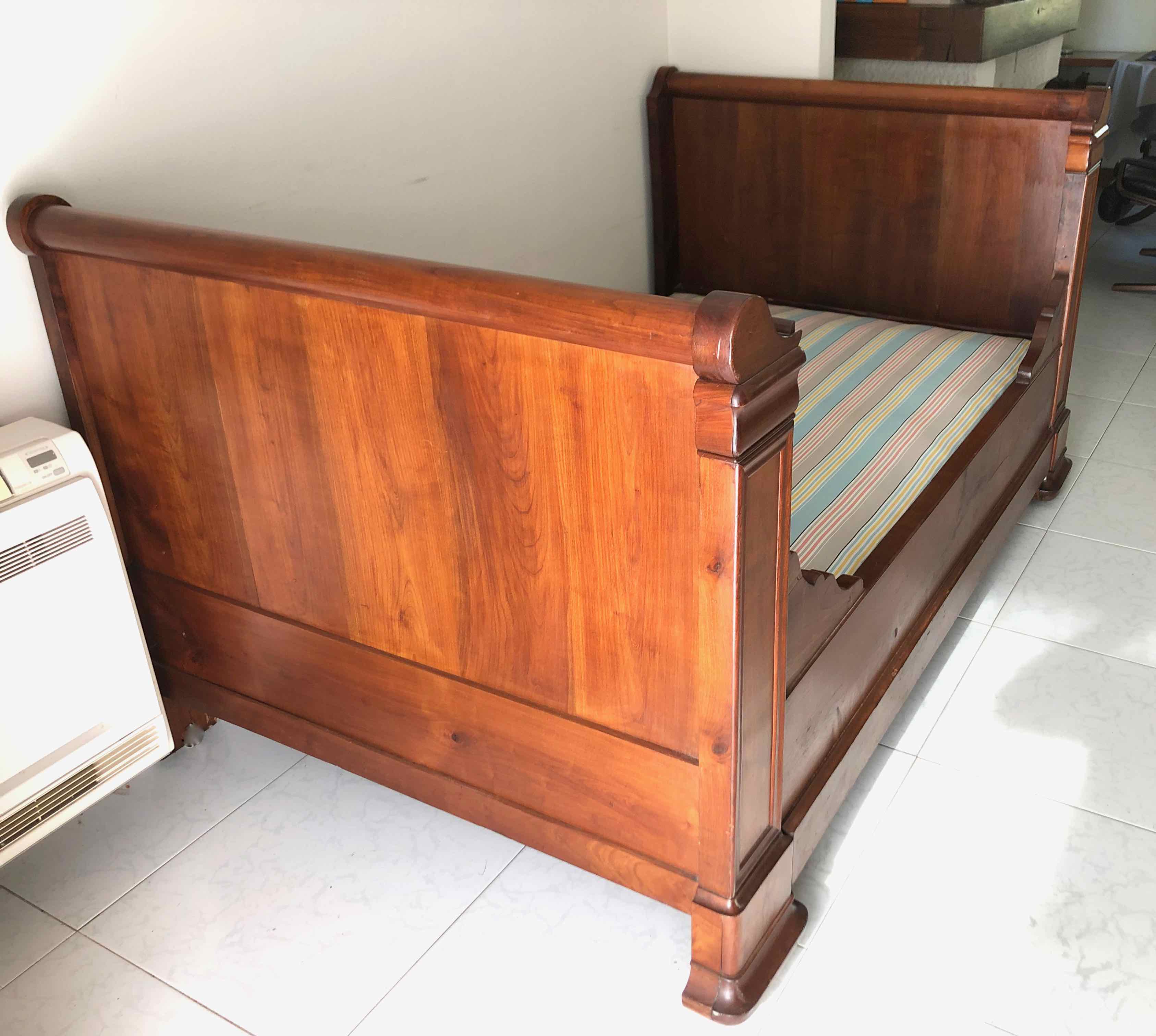 Cherry wood boat bed with bedding