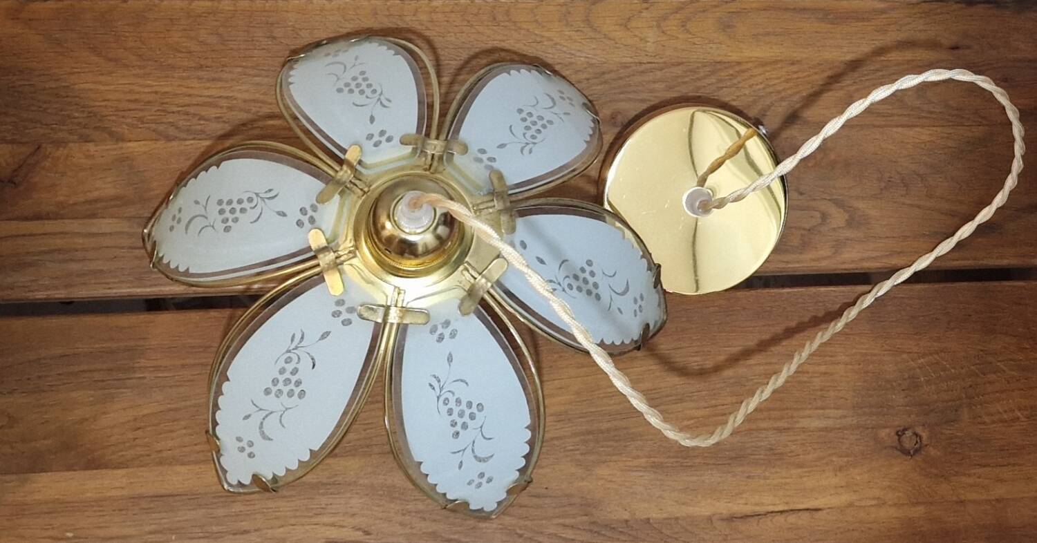 Glass flower rimmed with brass