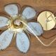 Glass flower rimmed with brass