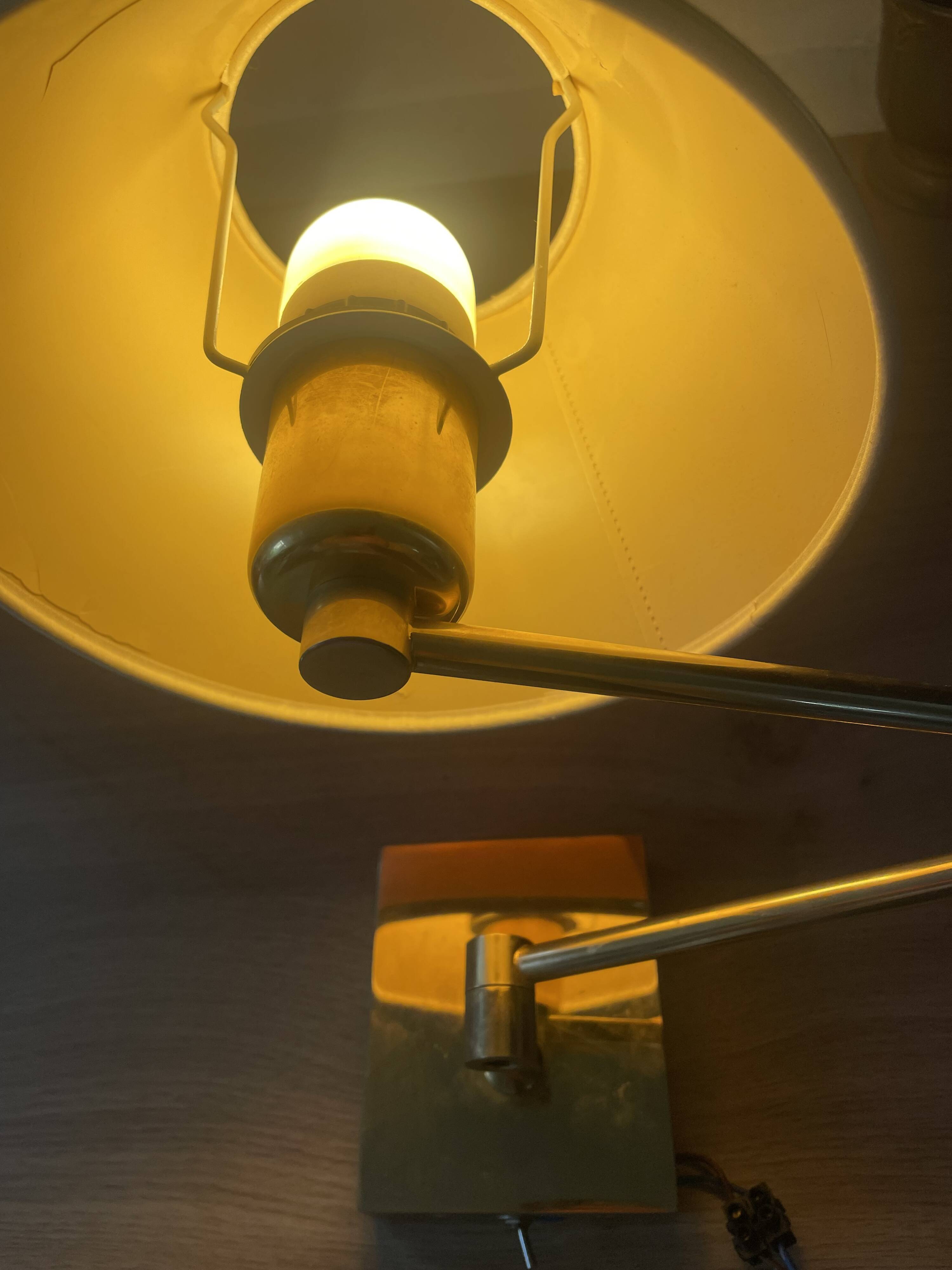 Pair of vintage brass wall lights with adjustable arms.