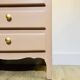 Pink wooden chest of drawers