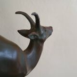 Pair - Chamois metal bookends with green patina & black marble base