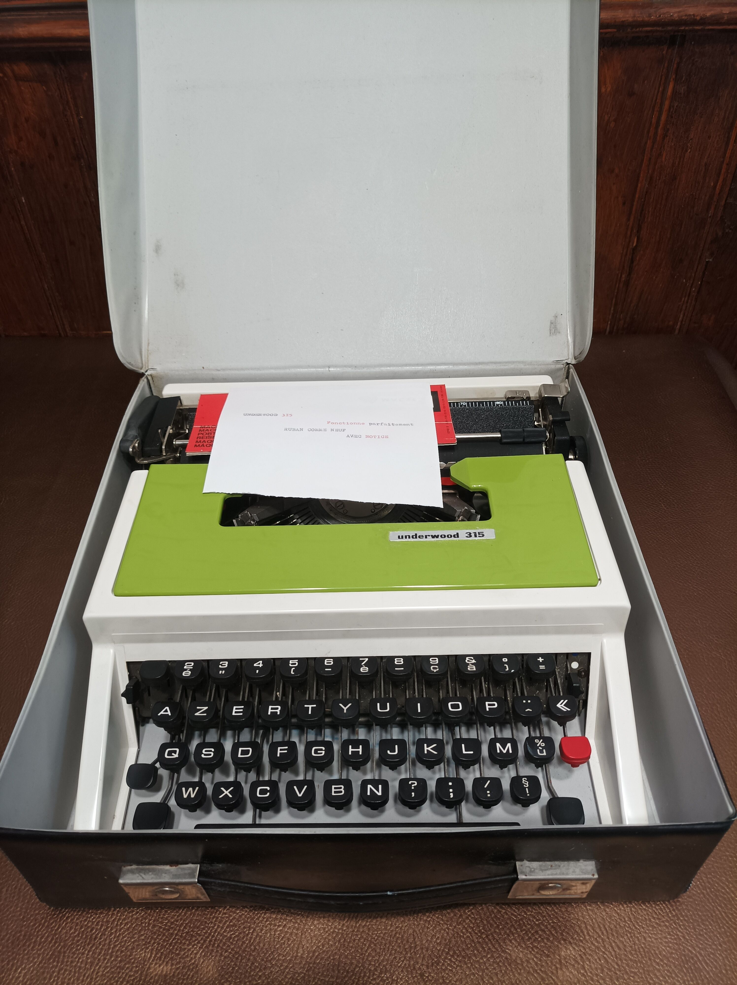Green Underwood 315 typewriter with its briefcase