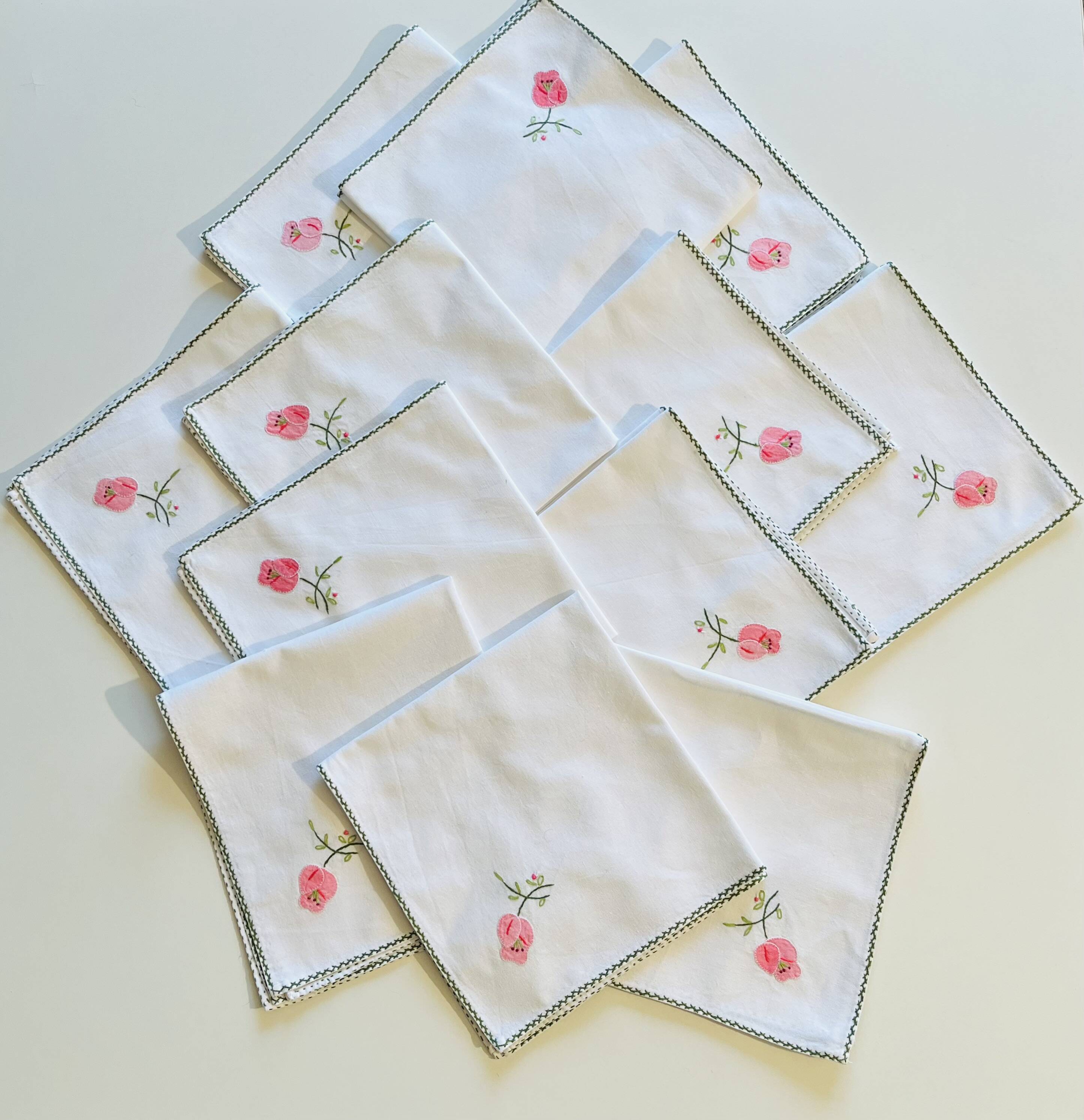 Set of 12 vintage hand-embroidered cotton white napkins.