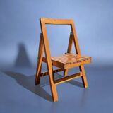 Old varnished wooden folding chair for children