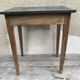 Old kitchen table in wood with compass feet