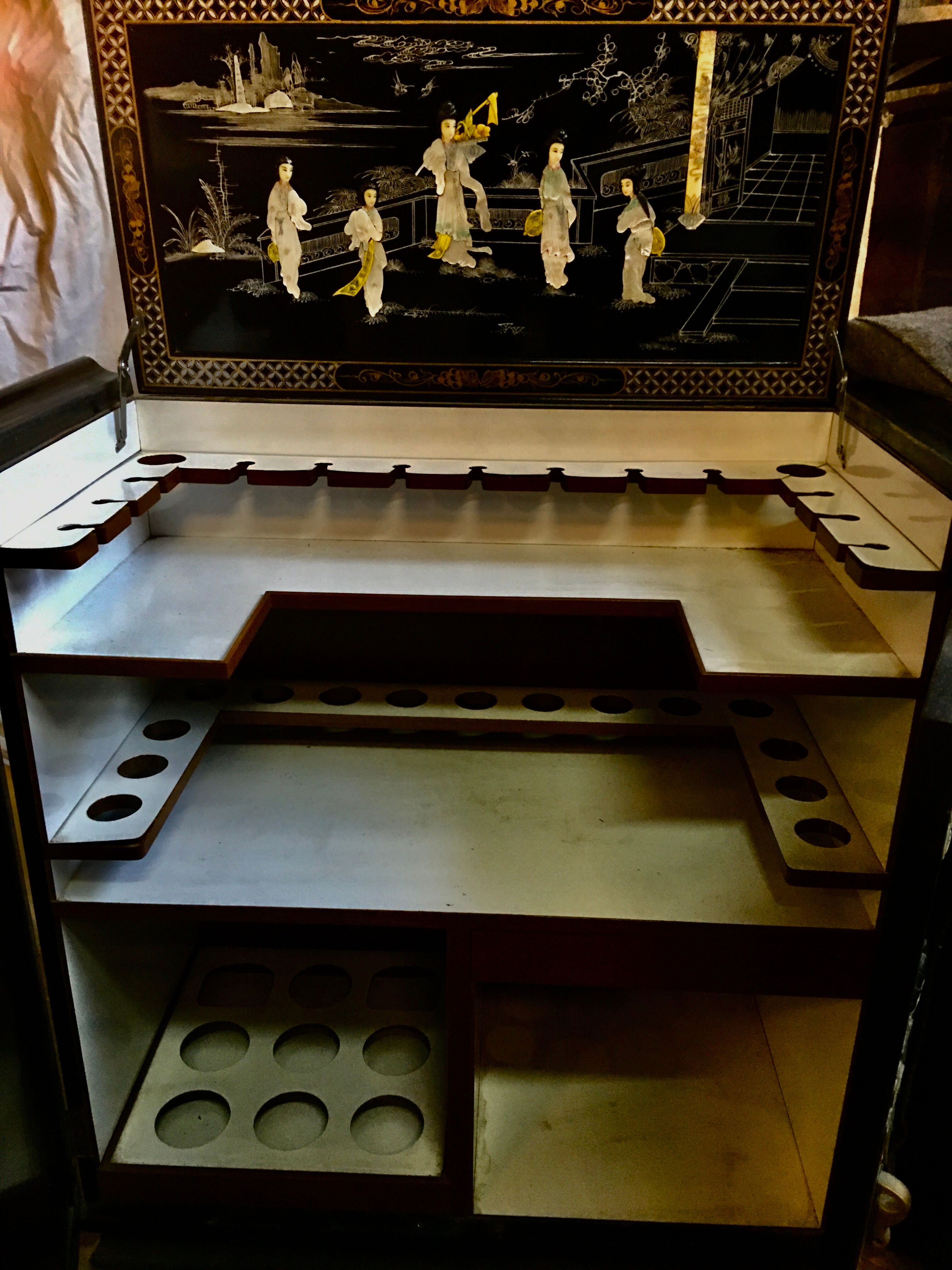 Asian lacquer cabinet with mother-of-pearl relief pattern