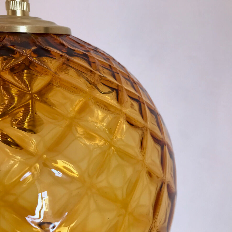 Amber glass globe suspension